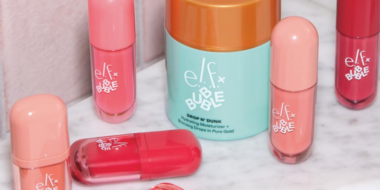 Assorted e.l.f. x Bubble makeup and skin-care products, including blush, lip and bronzing formulas, arranged on a marble surface.