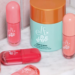 Assorted e.l.f. x Bubble makeup and skin-care products, including blush, lip and bronzing formulas, arranged on a marble surface.