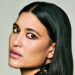 Close-up portrait of Julia Jones with sleek, side-parted black hair, softly smoky eye makeup and muted pink lipstick.